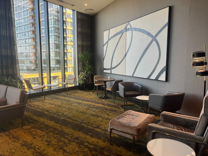 Comfortable seating area near the entrance of the JW Marriott Executive Lounge in Vancouver, BC.