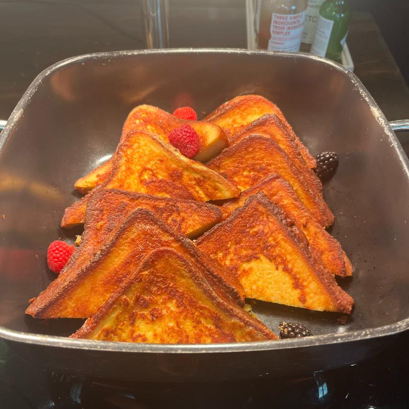 French toast with syrup and fresh berries at the JW Marriott Vancouver Executive Lounge breakfast buffet.