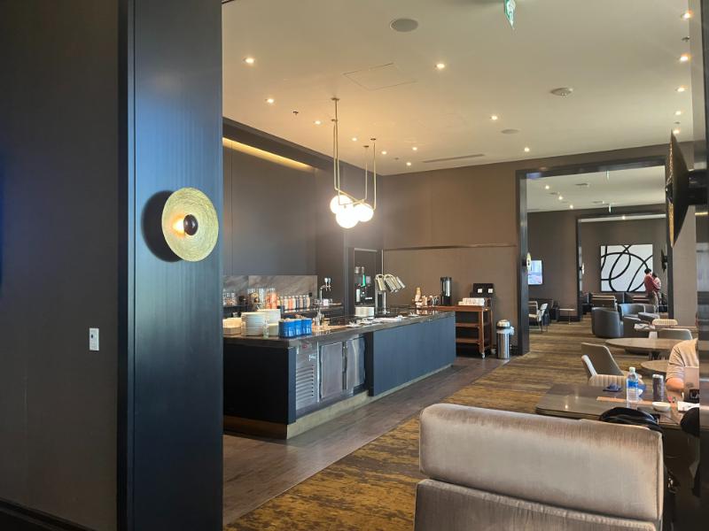Entrance view of the JW Marriott Executive Lounge showing buffet layout before appetizer service.