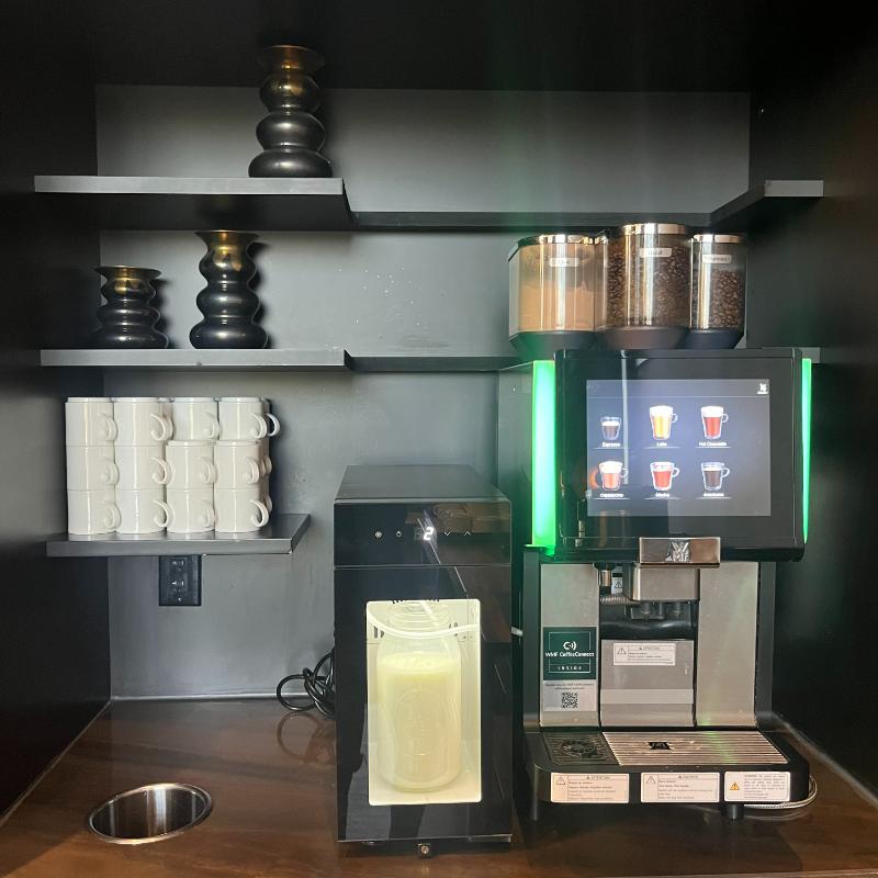Self-serve coffee and espresso machine inside the JW Marriott Executive Lounge in Vancouver.