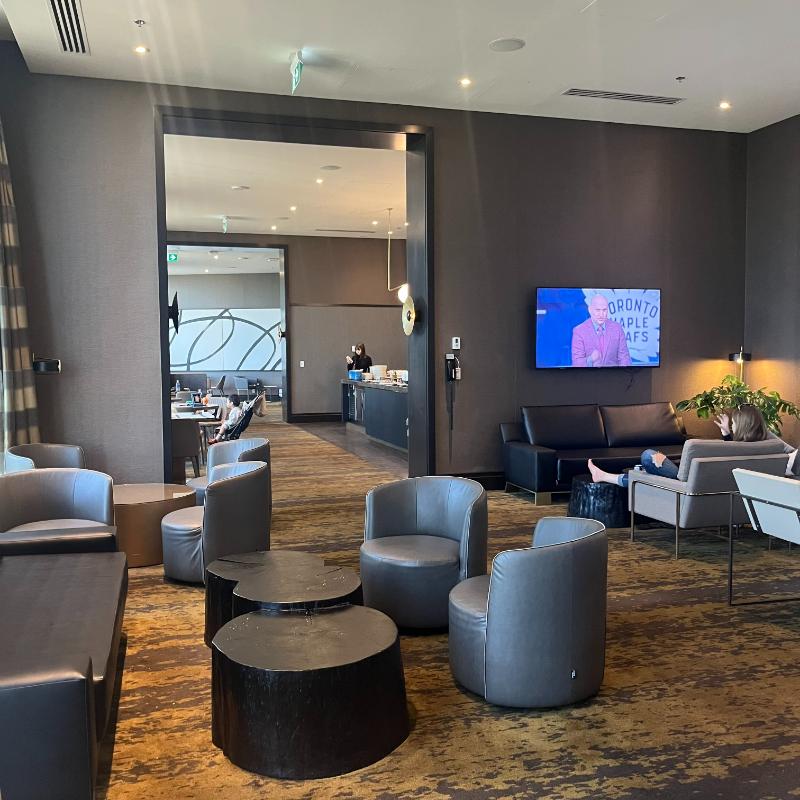 Lounge seating with large TVs, ideal for watching the NHL playoffs at JW Marriott Vancouver.