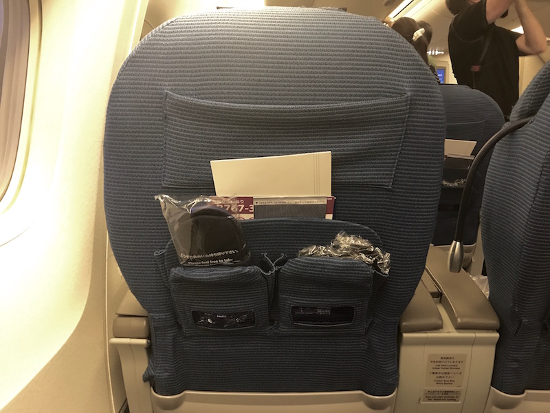 Slipper And Menu In Seat-Back Storage